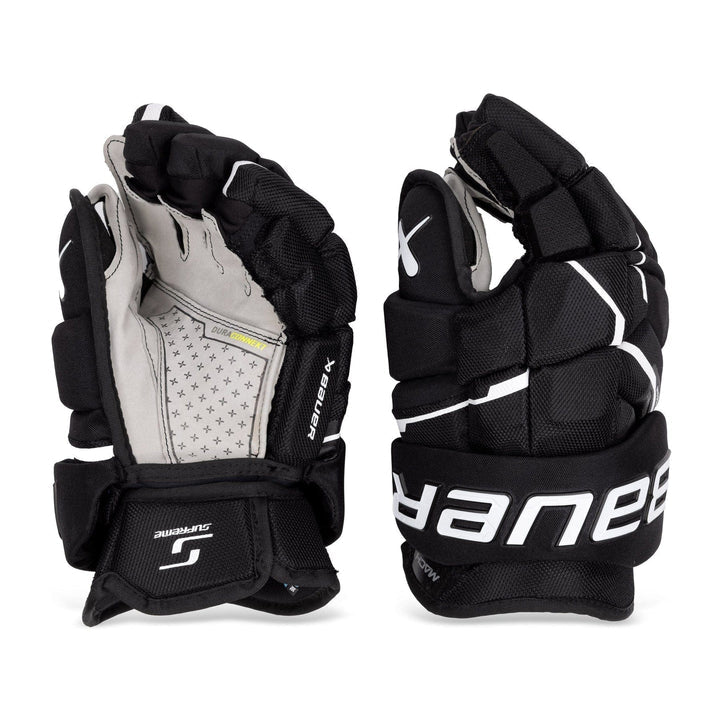 https://www.thehockeyshop.com/cdn/shop/files/bauer-gloves-bauer-supreme-mach-intermediate-hockey-gloves-black-white-12-30551259742274_720x.jpg?v=1699733149