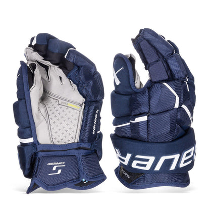 https://www.thehockeyshop.com/cdn/shop/files/bauer-gloves-bauer-supreme-mach-intermediate-hockey-gloves-navy-12-30597296750658_720x.jpg?v=1768105513